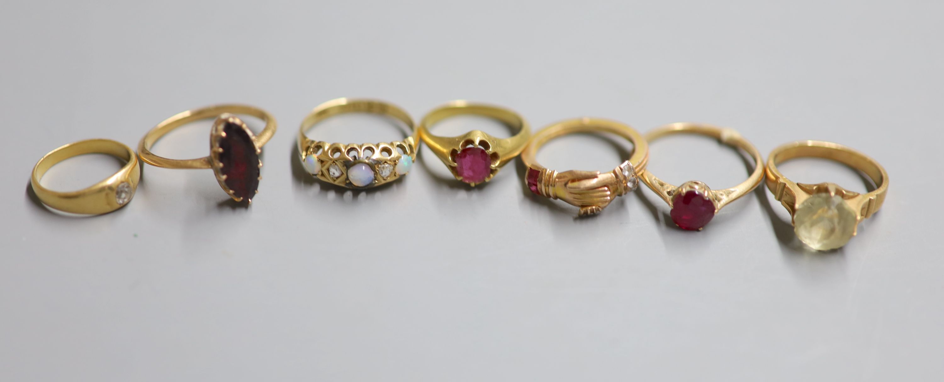 Seven assorted rings.